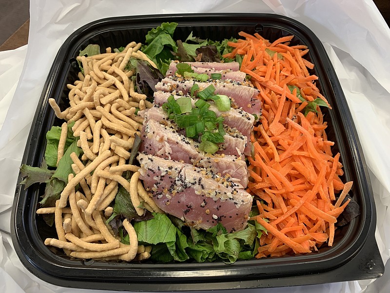 The Ahi Tuna Steak Salad at Two Sisters Uptown offers plenty of lightly seared tuna, shaved carrots and chow mein noodles on a bed of mixed greens, with a ginger sesame dressing. (Arkansas Democrat-Gazette/Eric E. Harrison)