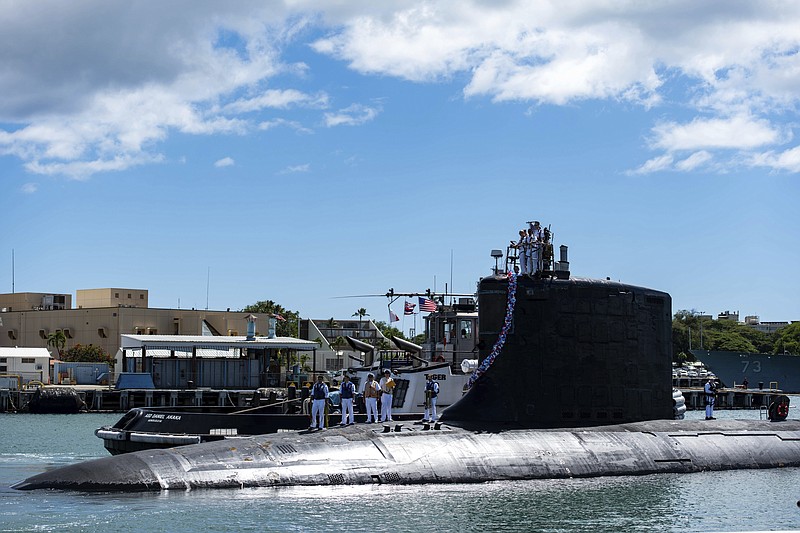 In this photo provided by U.S. Navy, the Virginia-class fast-attack submarine USS Illinois (SSN 786) returns home to Joint Base Pearl Harbor-Hickam from a deployment in the 7th Fleet area of responsibility on Monday. Australia decided to invest in U.S. nuclear-powered submarines and dump its contract with France to build diesel-electric submarines because of a changed strategic environment, Prime Minister Scott Morrison said on Thursday. - Photo by Mass Communication Specialist 1st Class Michael B. Zingaro/U.S. Navy via The Associated Press