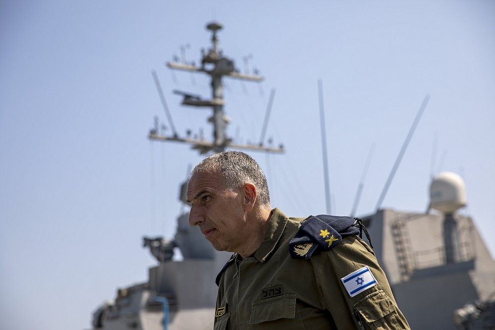 Vice Adm. Eli Sharvit arrives on board the Israeli Navy Ship Atzmaut in the Mediterranean Sea, Wednesday, Sept. 1, 2021. In an interview with the Associated Press, Sharvit, Israel's just-retired navy chief, described Iranian activities on the high seas as a top Israeli concern and said the navy is able to strike wherever necessary to protect the country’s economic and security interests. (AP Photo/Ariel Schalit)