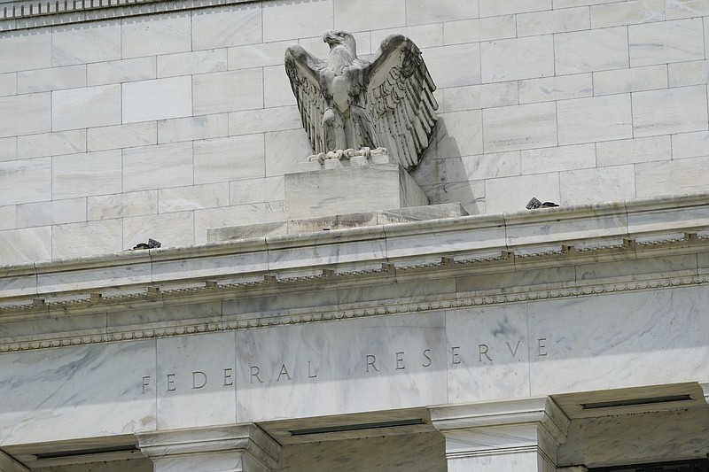 FILE - This May 4, 2021 file photo shows the Federal Reserve building in Washington.  The Federal Reserve said Thursday, Sept. 16,  that it is reviewing its ethics policies governing senior officials' financial holdings, in the wake of disclosures that two regional Fed presidents engaged in extensive trading last year.  (AP Photo/Patrick Semansky, File)