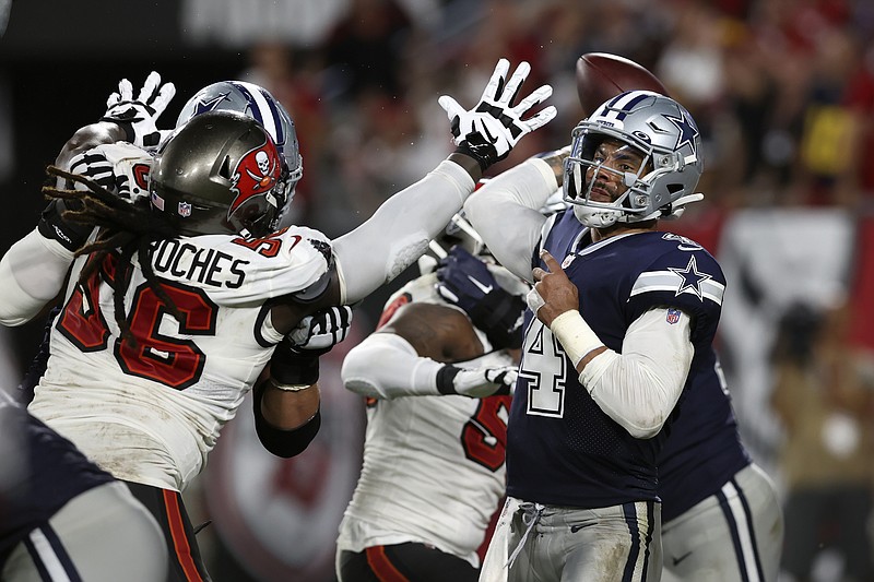 Dallas Cowboys quarterback Dak Prescott (4) is pressured by Tampa Bay Buccaneers defensive tackle Rakeem Nunez-Roches (56) during the second half of a Sept. 9 NFL game in Tampa, Fla. - Photo by Mark LoMoglio of The Associated Press