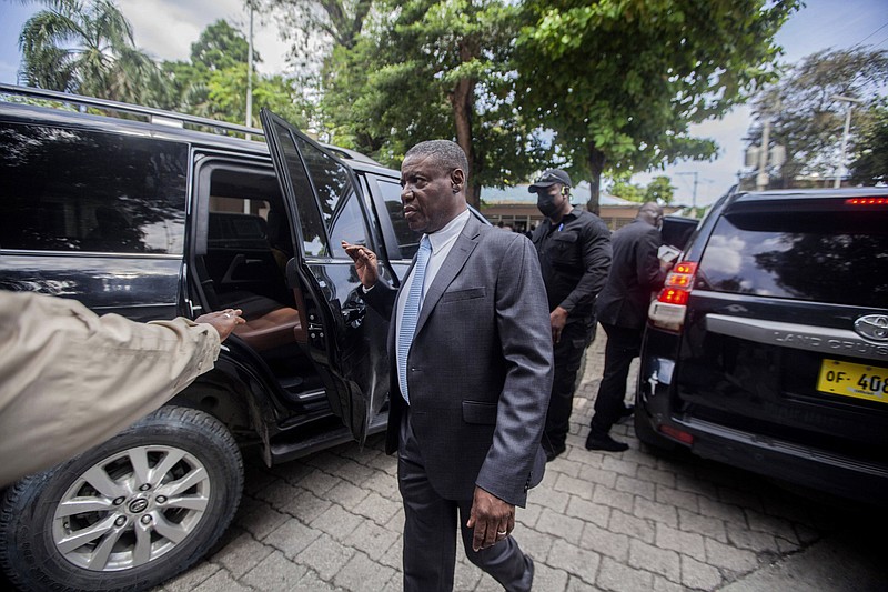 Haiti's newly-named Justice Minister Liszt Quitel, leaves after he was installed in office, in Port-au-Prince, Haiti, Thursday. - AP Photo/Richard Pierrin