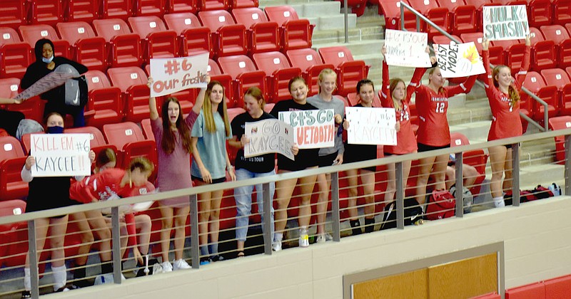 MARK HUMPHREY  ENTERPRISE-LEADER/Farmington freshman Kaycee McCumber, promoted to varsity for Thursday's match against Harrison, got visible and vocal support from classmates and junior varsity teammates lining up in the student section.