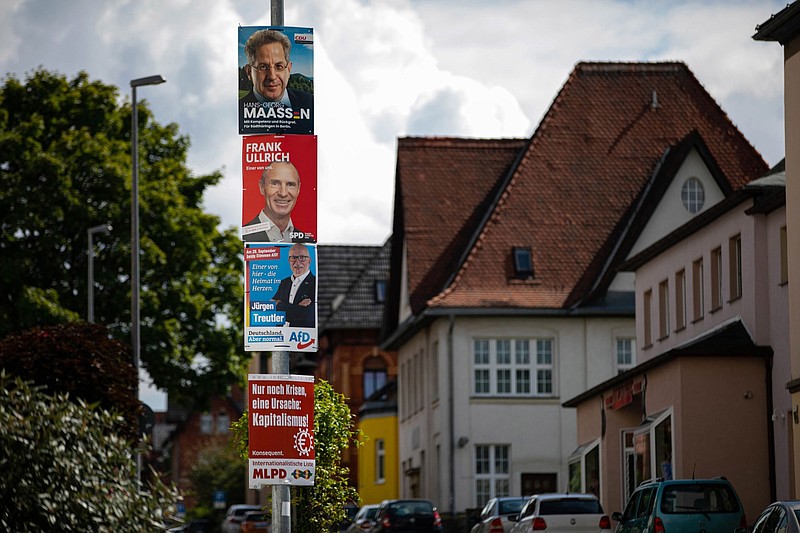 Political campaign posters of the Social Democratic Party (SPD), Alternative for Germany (AfD), Christian Democratic Union (CDU) and Marxist-Leninist Party (MLPD) for the Bundestag general election on a street in Sonneberg, Germany, on Aug. 30, 2021. MUST CREDIT: Bloomberg photo by Krisztian Bocsi.