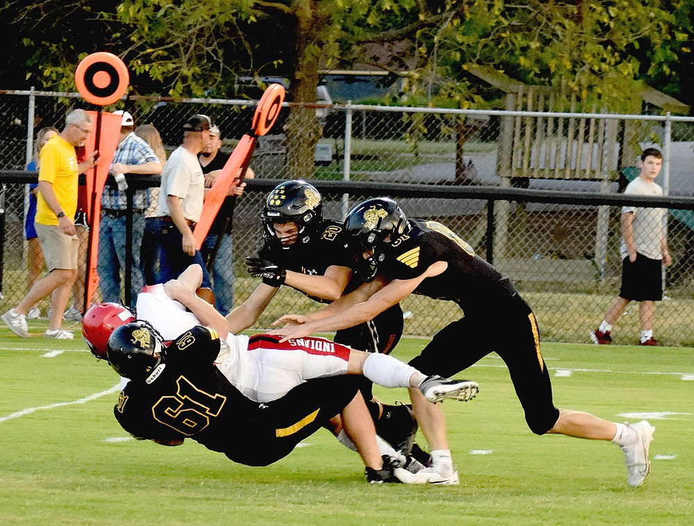 MARK HUMPHREY ENTERPRISE-LEADER/Prairie Grove senior defensive end John King (5-feet-7, 155 pounds) drops a Stilwell player several yards behind the line-of-scrimmage. Prairie Grove head coach describes King as an undersized player with a big heart. King made several tackles on kickoff coverage Friday.