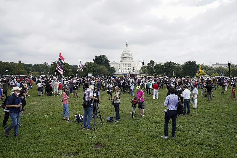 People attend a rally near the U.S. Capitol in Washington, Saturday, Sept. 18, 2021. The rally was planned by allies of former President Donald Trump and aimed at supporting the so-called &quot;political prisoners&quot; of the Jan. 6 insurrection at the U.S. Capitol. (AP Photo/Jose Luis Magana)