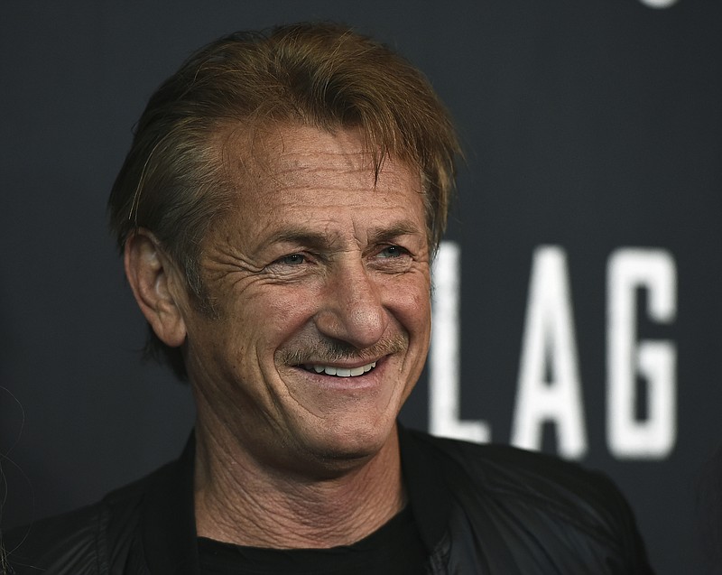 FILE - In this Aug. 11, 2021 file photo, Sean Penn arrives at the Los Angeles premiere of &quot;Flag Day&quot; at the Directors Guild of America Theater in Los Angeles.  A disaster relief organization founded by Penn is boosting Georgia's drive to inoculate people against the coronavirus, though some of its pop-up vaccine clinics have struggled to attract people.(Photo by Jordan Strauss/Invision/AP, File)