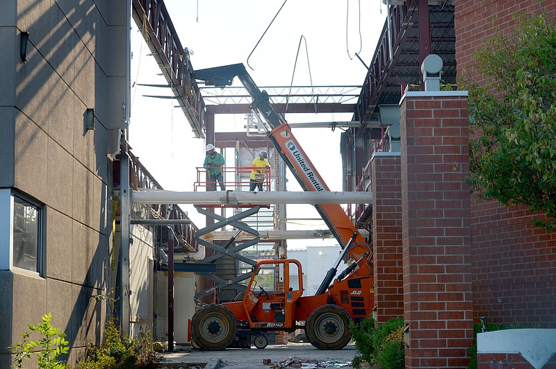 Workers disassemble a portion of the former Springdale City Administration Building Friday, Sept. 17, 2021, in downtown Springdale. This area of the building and campus will be home to the Planning Department, Building Department, Engineering Department, City Clerk and the mayor?s staff. Visit nwaonline.com/210919Daily/ for today's photo gallery.
(NWA Democrat-Gazette/Andy Shupe)
