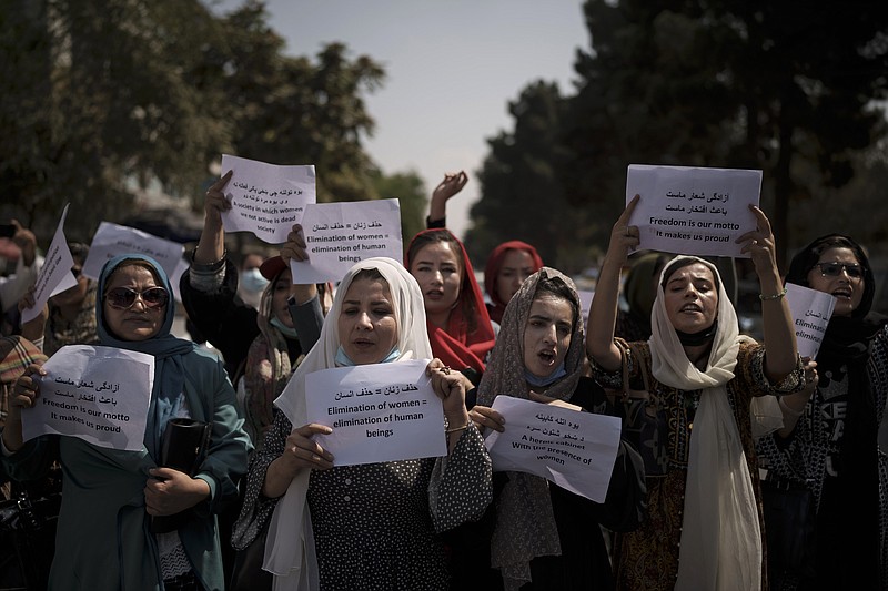 Afghan women march to demand their rights under the Taliban rule during a demonstration near the former Women's Affairs Ministry building in Kabul, Afghanistan, Sunday, Sept. 19, 2021. The interim mayor of Afghanistan&#x2019;s capital said Sunday that many female city employees have been ordered to stay home by the country&#x2019;s new Taliban rulers. (AP Photo)