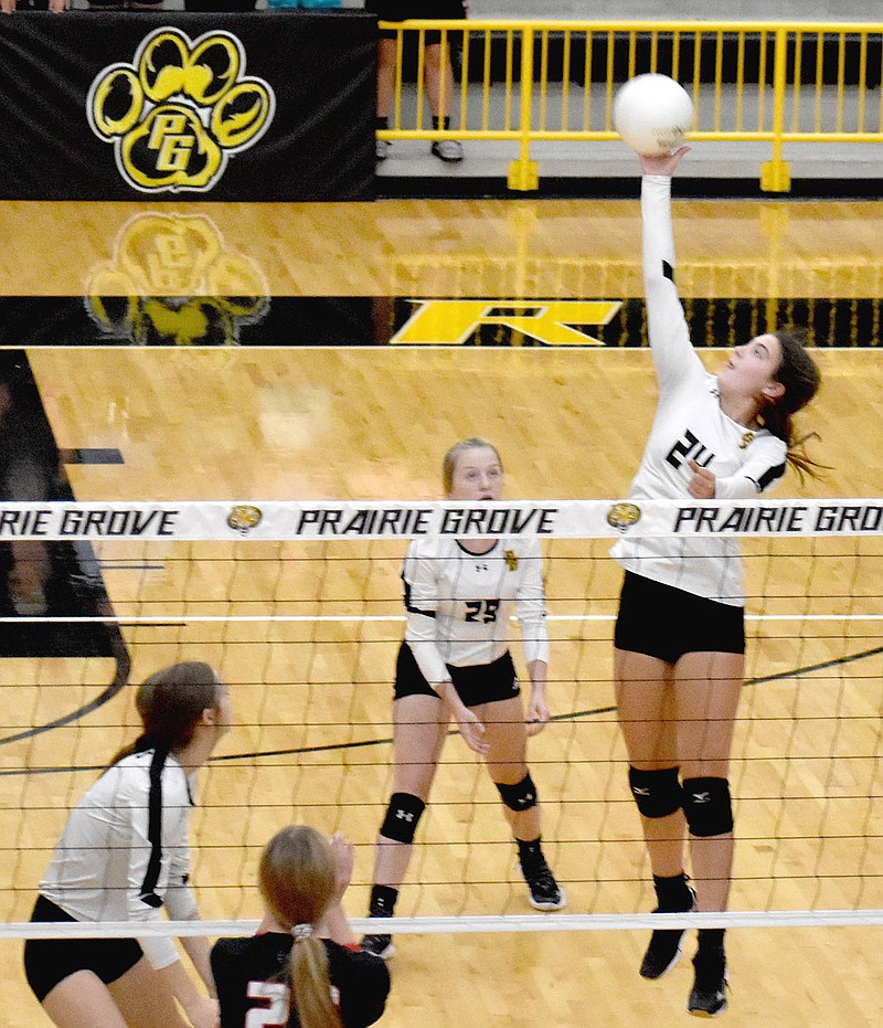 MARK HUMPHREY  ENTERPRISE-LEADER/Prairie Grove junior Kenleigh Elder goes up high to smash the ball over the net. Elder led the Lady Tigers with 18 kills while contributing 16 digs and 3 blocks during a Tuesday, Sept. 14 home court, 25-21, 20-25, 17-25, 25-27, loss to Pea Ridge in 4A-1 volleyball action.