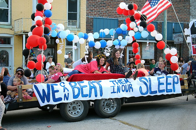 MEGAN DAVIS/MCDONALD COUNTY PRESS Adorned with hair cullers and pajames, riders on White Rock Elementary's blanket-filled float touted that McDonald County could beat the Monett Cubs in their sleep.