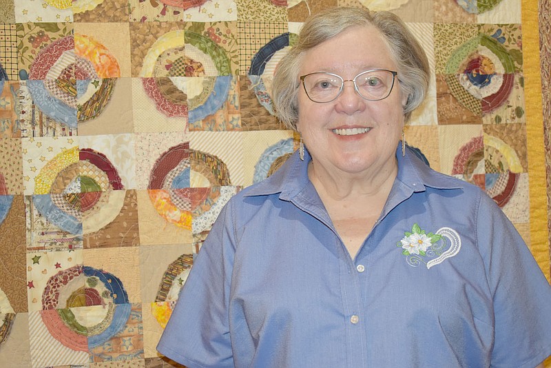 Rachel Dickerson/The Weekly Vista Jean Justice of Bella Vista is pictured with a quilt she made. Quilting is one of several interests she pursues.