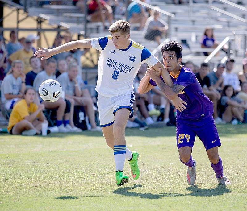 Photo courtesy of JBU Sports Information
John Brown's Kolby McCombs holds off a Bethel defender during last Saturday's game.