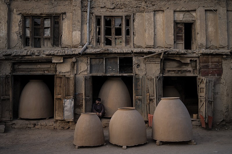 An Afghan potter sits among tandoor ovens in Kabul, Afghanistan, Monday, Sept. 20, 2021. (AP Photo/Bernat Armangue)