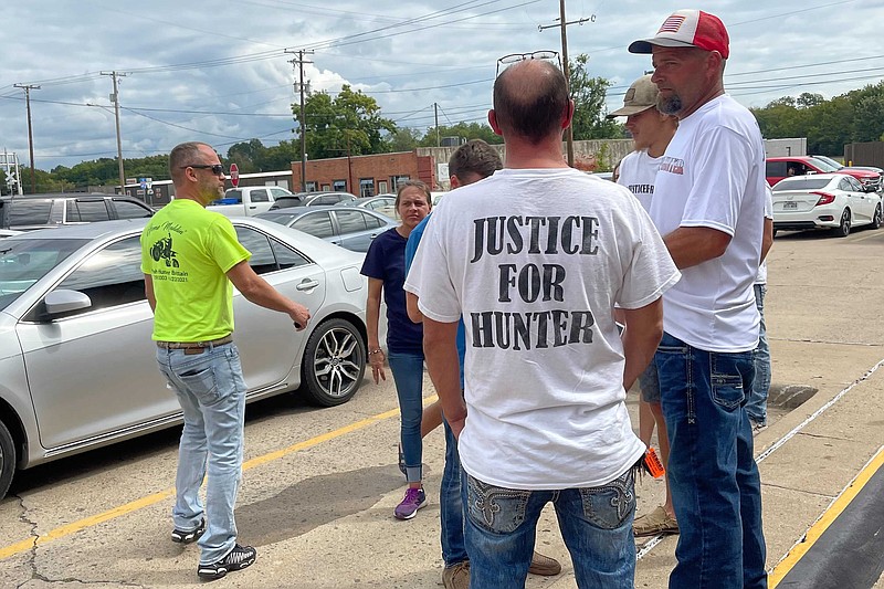 Friends and family of 17-year-old Hunter Brittain gather outside the Pope County Courthouse in Russellville, Arkansas on Friday, Sept. 17, 2021. Michael Davis, a former Lonoke County sheriff's deputy, was charged with manslaughter for fatally shooting the white teenager during a June 23, 2021 traffic stop. (AP Photo/Andrew Demillo)