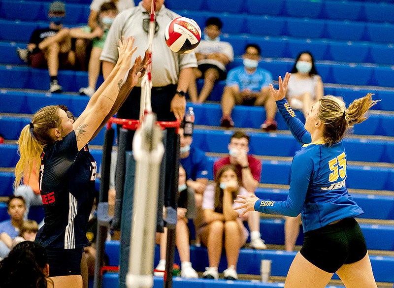 Photo courtesy of JBU Sports Information
John Brown's Taylor Golmen (right) goes up for a hit against Oklahoma Panhandle State last weekend. JBU beat the Aggies 3-1.