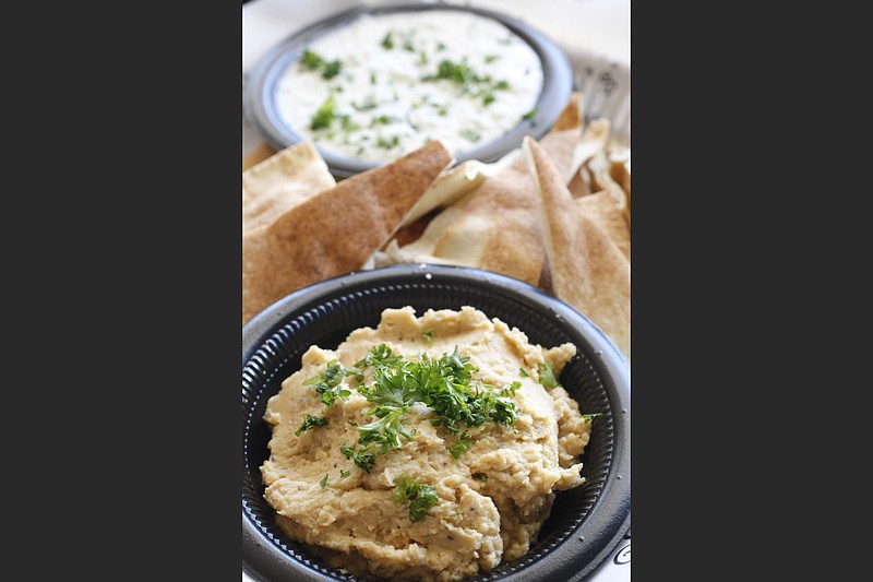 Taziki’s central Arkansas locations will give away free hummus with entree orders on Saturday to mark the franchise’s 13th anniversary here. (Democrat-Gazette file photo)