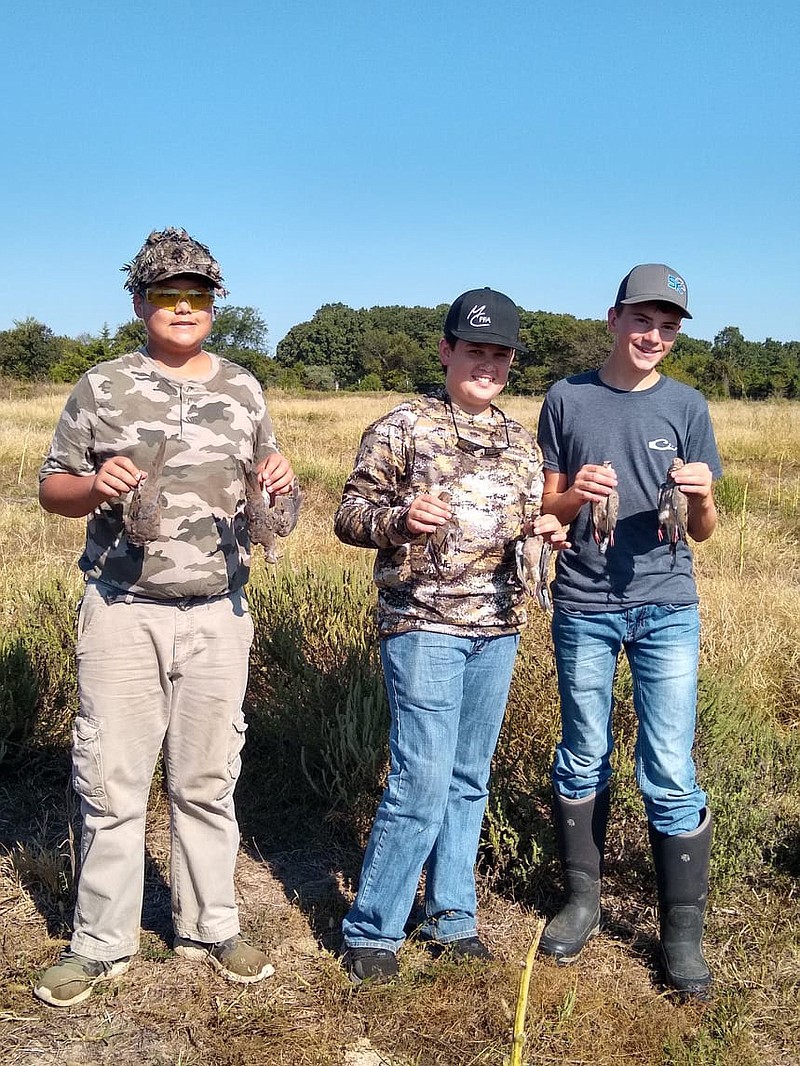 Photo Submitted These three youth participated in the Young Outdoorsmen United Youth Dove Hunt on Sept. 18. The focus of the event is to pair experienced hunters with unexperienced hunters offering them a chance to experience wing shooting with volunteers around them.