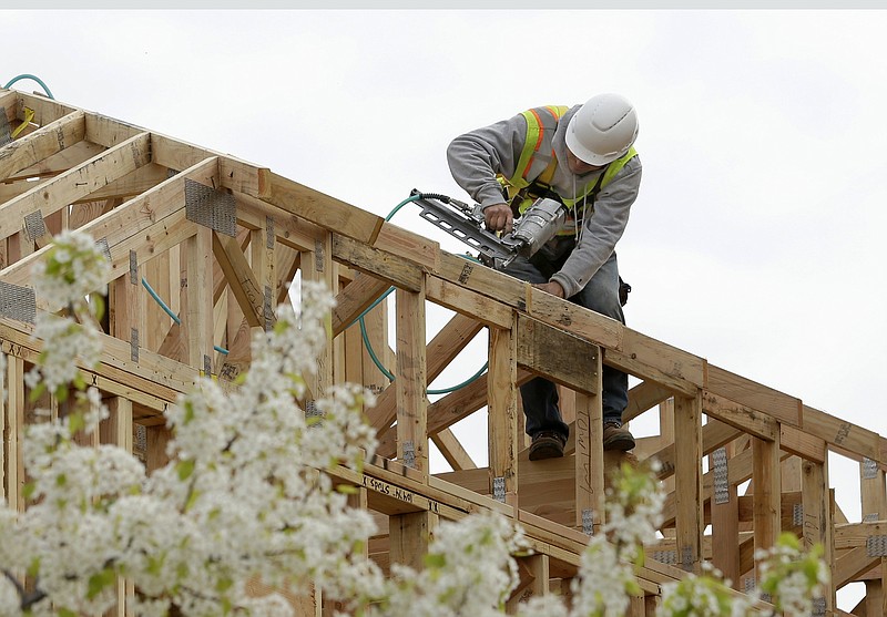 FILE - In this Feb. 8, 2019 file photo, work is done on an apartment building under construction in Sacramento, Calif. California lawmakers have advanced the second of two measure's designed to ease local zoning ordinances for home construction. Spurred by an affordable housing shortage, spiking home prices and intractable homelessness, California lawmakers on Thursday, Aug. 26, 2021,  advanced the second of two measures designed to cut through local zoning ordinances. (AP Photo/Rich Pedroncelli, File)