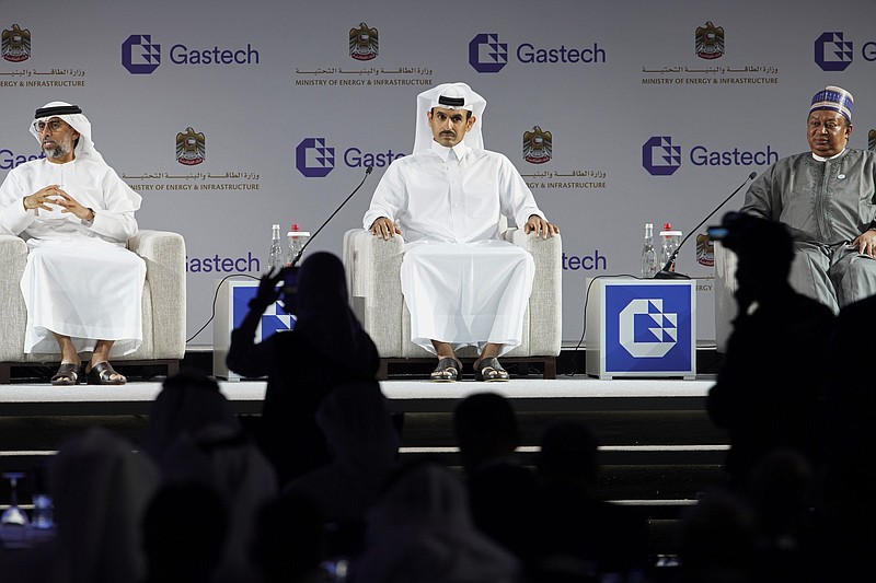 From left, Emirati Energy and Infrastructure Minister Suhail al-Mazrouei, Qatar's Minister of State for Energy Affairs Saad Sherida al-Kaabi and OPEC Secretary-General Mohammad Sanusi Barkindo sit on stage during the Gastech 2021 conference in Dubai, United Arab Emirates, Tuesday, Sept. 21, 2021. Energy officials from Qatar and Turkey, long-standing foes of the United Arab Emirates, descended on Dubai along with hundreds of other executives on Tuesday, flocking to the largest gas expo in the world and the industry's first in-person conference since the pandemic began.