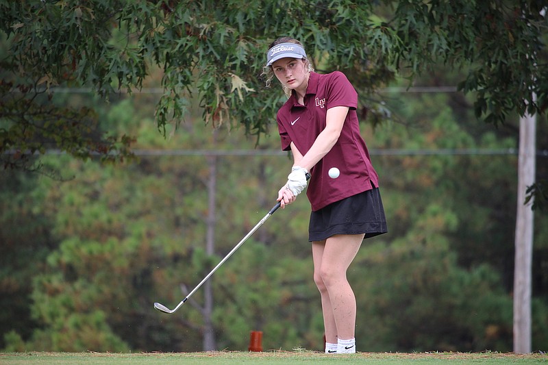 Lake Hamilton's Jordyn Garner chips onto the green at the 5A-South Conference Golf Tournament Tuesday at Glenwood Country Club. - Photo by Krishnan Collins of The Sentinel-Record