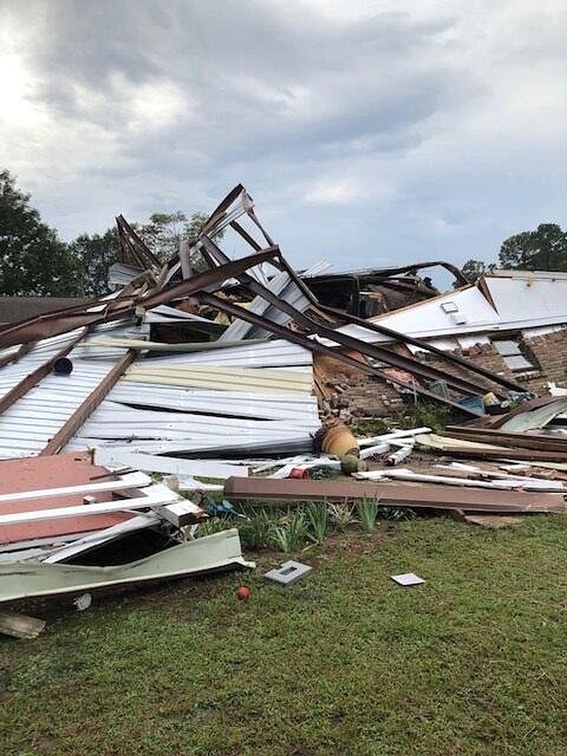 Heavy winds caused a large metal barn/shop to collapse into a home, crushing the residence and vehicles stored in its garage at the 4700 block of West 13th Avenue. (Special to The Commercial/Jefferson County Sheriff's Office)