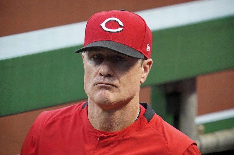 Cincinnati Reds manager David Bell stands in the dugout during a baseball game against the Pittsburgh Pirates in Pittsburgh, Tuesday, Sept. 14, 2021. (AP Photo/Gene J. Puskar)