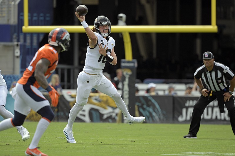 Jacksonville Jaguars quarterback Trevor Lawrence, right, throws a pass against the Denver Broncos during the first half on Sunday in Jacksonville, Fla. - Photo by Phelan M. Ebenhack of The Associated Press