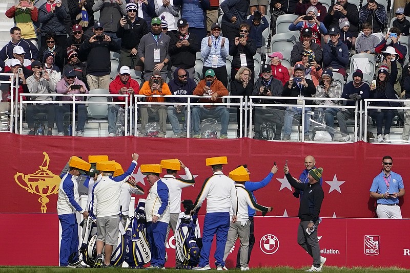 Team Europe wears cheeseheads on the first tee during a practice day at the Ryder Cup at the Whistling Straits Golf Course Wednesday in Sheboygan, Wis. - Photo by Jeff Roberson of The Associated Press