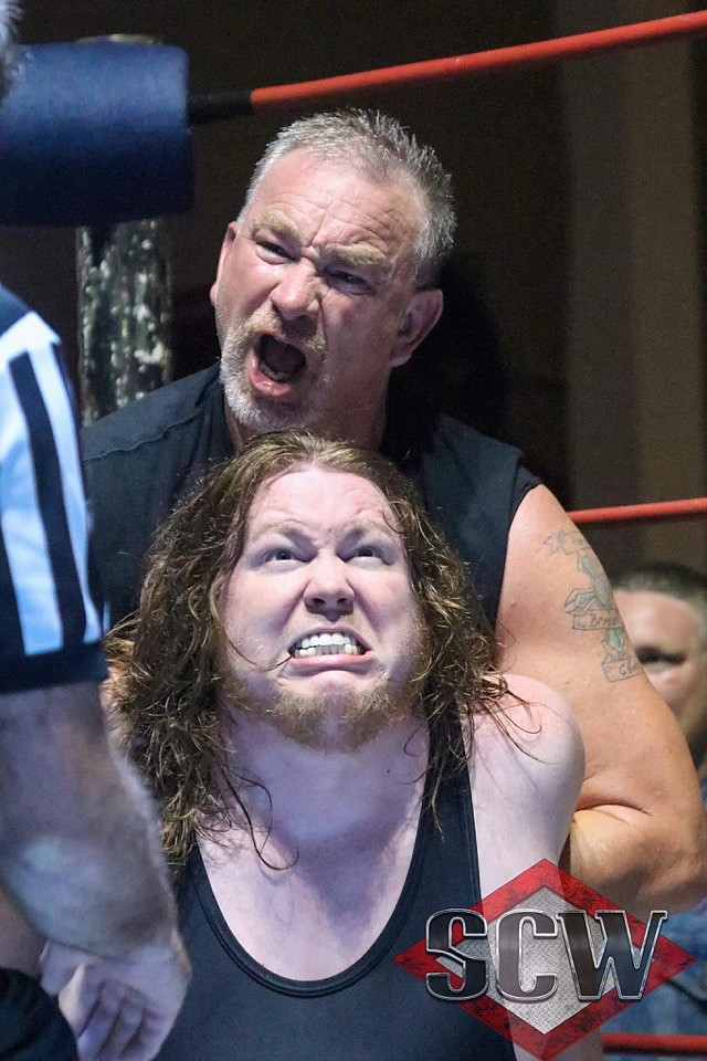 Wrestlers LiveWire and Leo Kegan fight at a South Central Wrestling event. SCW wrestlers will get to train with former WWE wrestler Al Snow in October. Photo courtesy of Mike Meeks. - Submitted photo