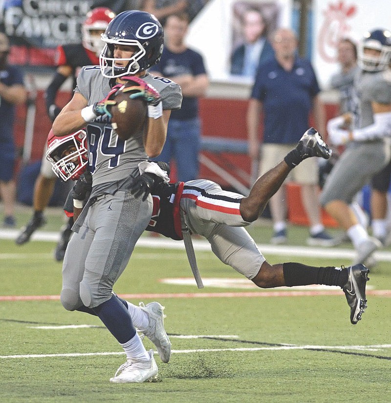 Fort Smith Northside defensive back Zavian Zeffer wraps up Greenwood receiver Luke Brewer in a game earlier this season. Zeffer has played a key role in Northside's 3-0 start. The Grizzlies will host Bryant in the 7A-Central Conference opener tonight.
NWA Democrat-Gazette file photo