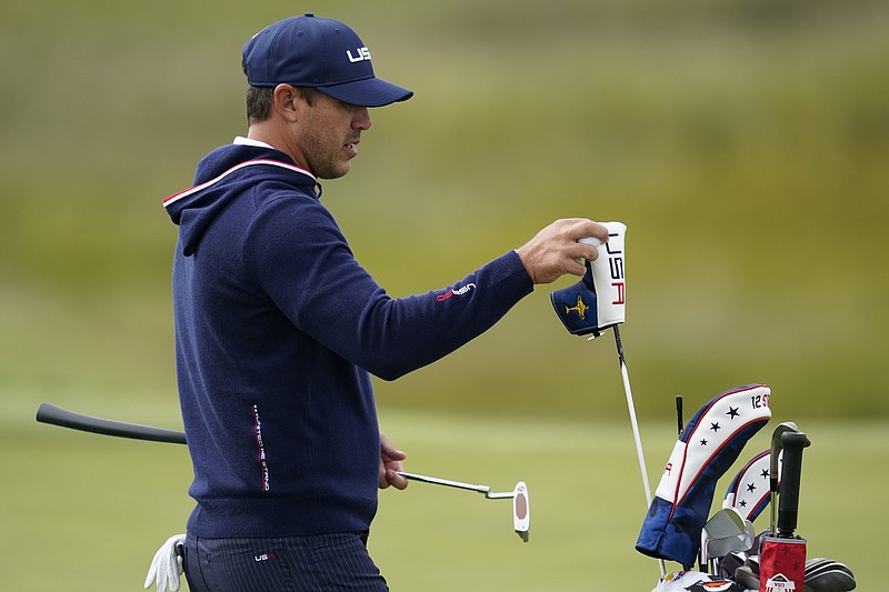 Team USA's Brooks Koepka gets a club on the 10th hole during a practice day at the Ryder Cup at the Whistling Straits Golf Course Wednesday, Sept. 22, 2021, in Sheboygan, Wis. (AP Photo/Ashley Landis)