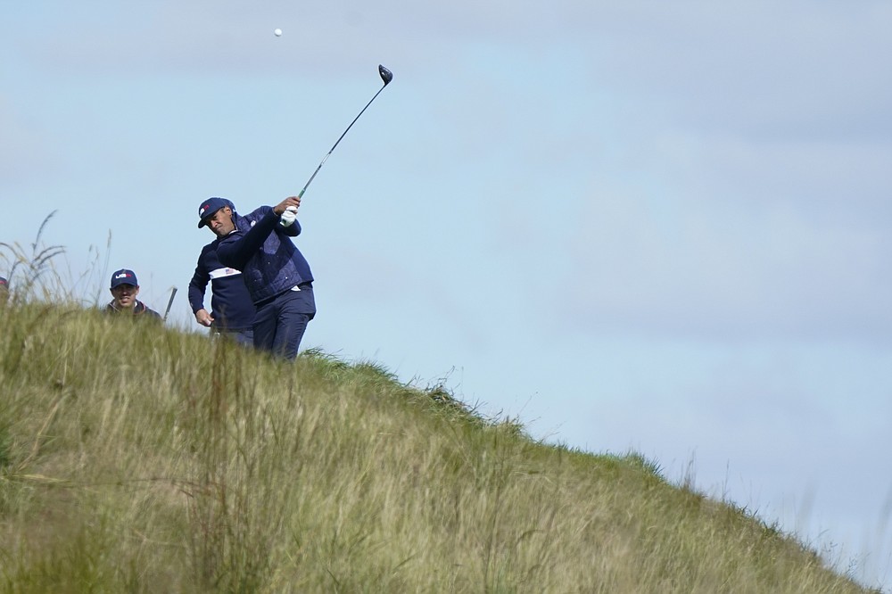 Team USA's Tony Finau hits a drive on the 14th hole during a practice day at the Ryder Cup at the Whistling Straits Golf Course Wednesday, Sept. 22, 2021, in Sheboygan, Wis. (AP Photo/Charlie Neibergall)