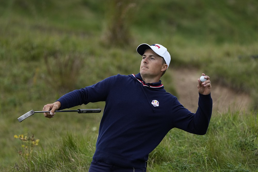 Team USA's Jordan Spieth throws a ball to a fan on the ninth hole during a practice day at the Ryder Cup at the Whistling Straits Golf Course Thursday, Sept. 23, 2021, in Sheboygan, Wis. (AP Photo/Ashley Landis)