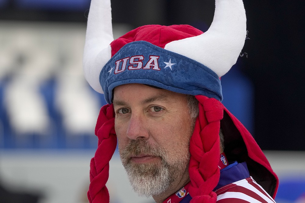 A fan waits for the start of the opening ceremony for the Ryder Cup at the Whistling Straits Golf Course Thursday, Sept. 23, 2021, in Sheboygan, Wis. (AP Photo/Charlie Neibergall)