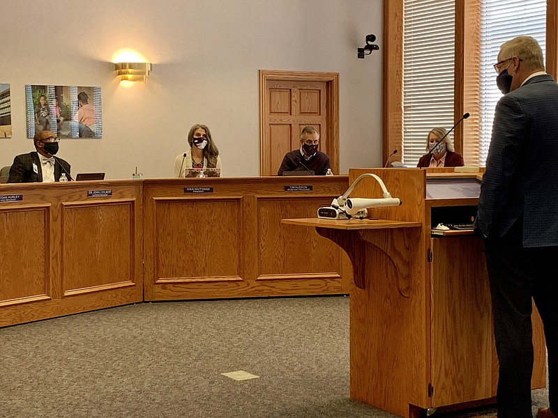 Steven Weber, teaching and learning associate superintendent, gives the annual report to patrons Thursday prior to the Fayetteville School District School Board meeting. (NWA Democrat-Gazette/Mary Jordan)