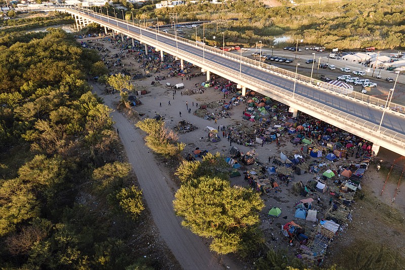 Migrants, many from Haiti, are seen in an encampment along the Del Rio International Bridge near the Rio Grande Thursday in Del Rio, Texas. - AP Photo/Julio Cortez