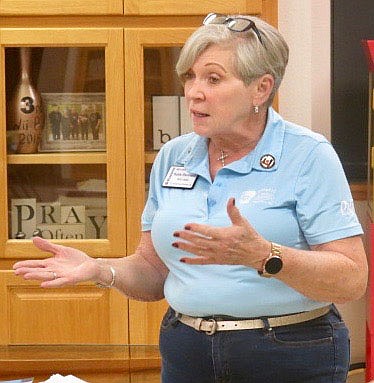 Westside Eagle Observer/SUSAN HOLLAND
Katie Rennard, of Siloam Springs, speaks to members of the Gravette Kiwanis Club at their installation banquet Thursday evening, Sept. 23. Rennard, who is Lt. Governor of MoArk District Kiwanis, was guest speaker at the meeting. She commended the Kiwanians for their past work and said she hoped the 2021-2022 year would be their &quot;best year ever.&quot;