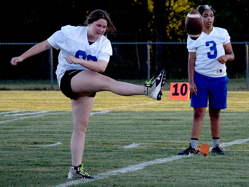 Westside Eagle Observer/MIKE ECKELS
Mariah Beats attempts a field goal from the 10 yard line during the first Bulldog Powderpuff Football contest at Bulldog Stadium in Decatur Thursday night. Beats made the kick, adding a point to the white team's score. The team later won 26-11.