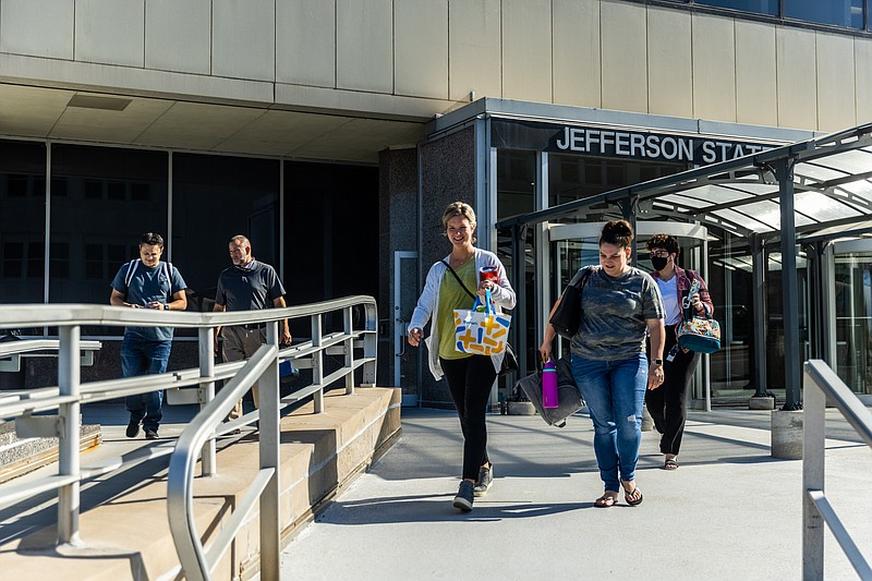 Ethan Weston/News Tribune A group of workers leave the Thomas Jefferson State Office Building on Wednesday, September 15, 2021 in Jefferson City, Mo.