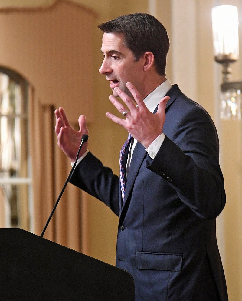 Tom Cotton stands at the podium at the Arlington for the Republican dinner.
