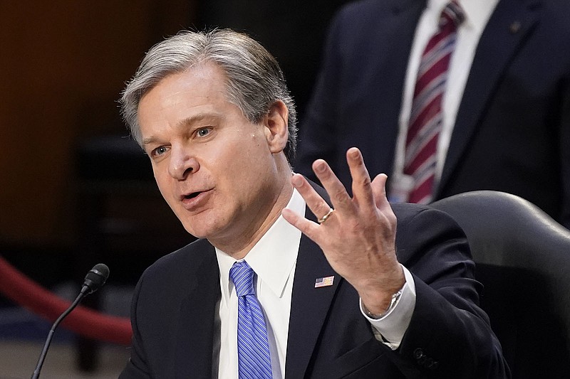 FBI Director Christopher Wray testified to Congress in March that the FBI was studying the quality of the intelligence it had gathered about Jan. 6. No informant was mentioned.  (AP Photo/Patrick Semansky)