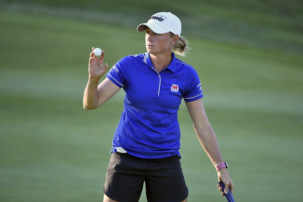 Stacy Lewis waves to fans after sinking her putt on the 9th green during the second round of the LPGA Walmart NW Arkansas Championship golf tournament, Saturday, Sept. 25, 2021, in Rogers, Ark. (AP Photo/Michael Woods)