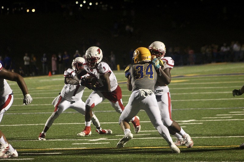 Photo By: Patric Flannigan
Camden Fairview running back Ja'Coriae Brown takes the handoff by quarterback Martavius Thomas