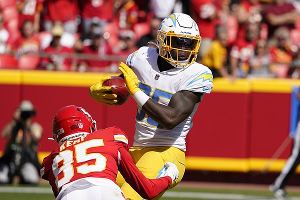 Kansas City Chiefs quarterback Patrick Mahomes runs the ball during the  second half of an NFL football game against the Los Angeles Chargers  Sunday, Sept. 26, 2021, in Kansas City, Mo. (AP