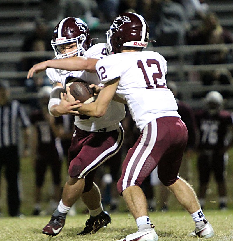 Submitted/NIKKI SLONE RAYBURN-STILL
The ball exchanges hands between Chris Bell and Addison Taylor during play at Huntsville on Friday night.