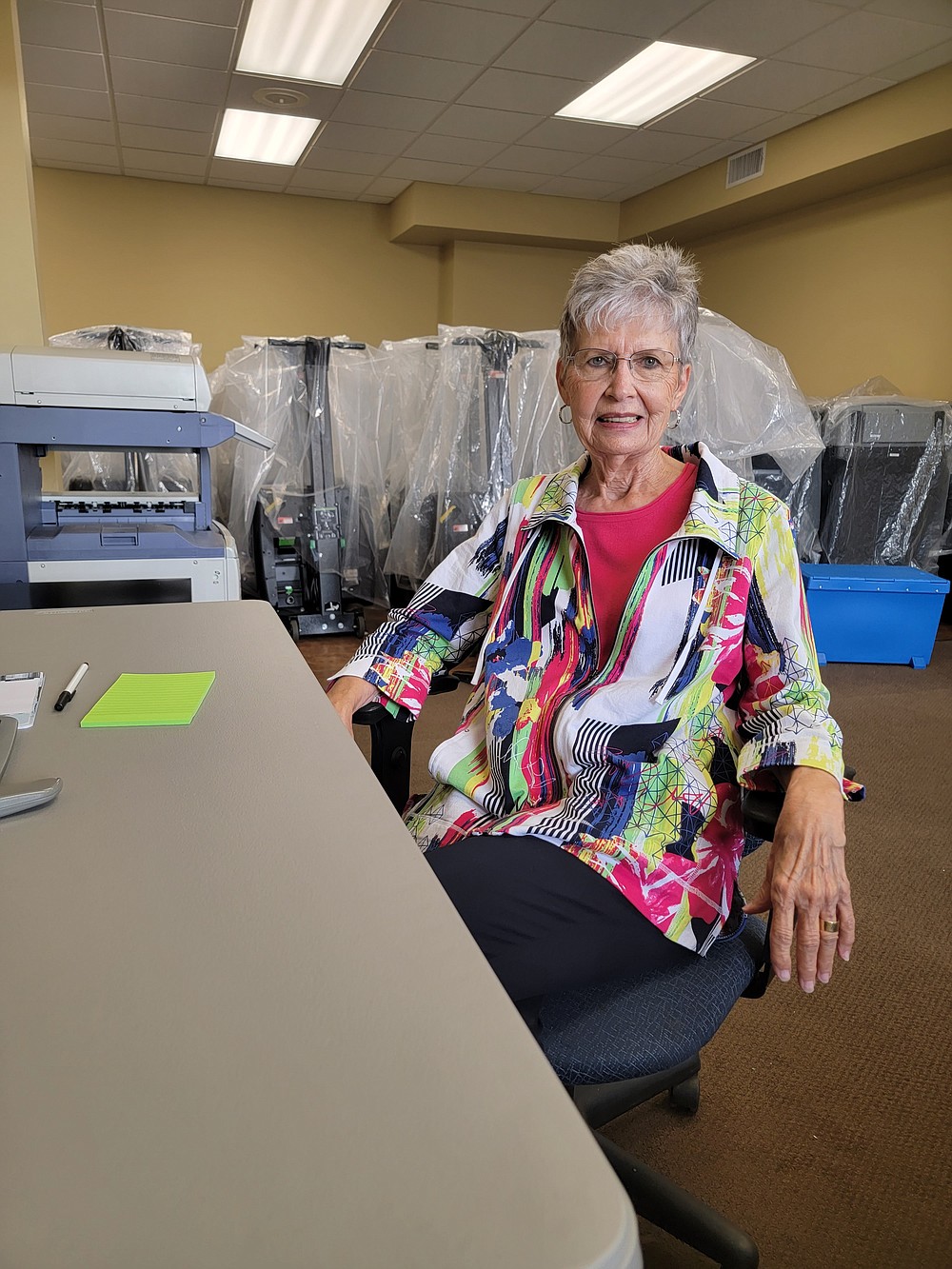 Linda Crawford, Miller County election coordinator, stands with some of Miller County election equipment the county received in 2017. (Staff photo by Christy Busby Worsham)