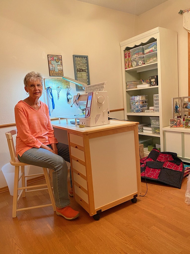 Linda Crawford sits in her sewing room. She took up the art form when she retired in 2006. (Photo by Rachel Grimmett)