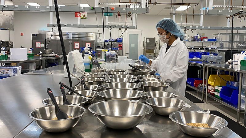 Celeste Holz-Schietinger, VP of product innovation at Impossible Foods, stands in the company?s test kitchen in Redwood City, Calif., on Sept. 21, 2021. The plant-based nuggets taste are designed to taste like chicken.
