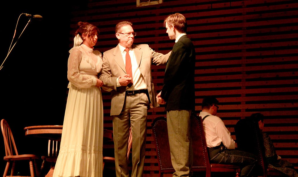 Andrew Mobley / Special to the Herald-Leader Michael G. Rivera (center) playing Mr. Webb, father of Emily Webb, played by Carson Hamilton (left) asks George Gibbs, played by Jonah Morgan (right), s 'he will take care of his daughter when they got married during the production of